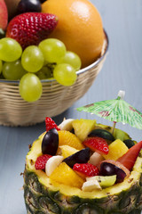 Fresh fruit salad served in bowls with fresh pineapple