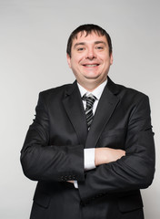 Fashion young businessman black suit  studio