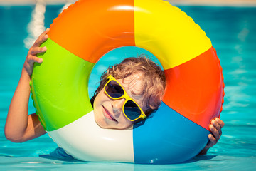 Child playing in swimming pool