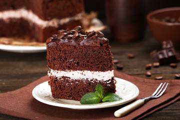 Delicious chocolate cake on table close-up