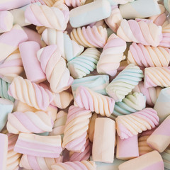 A delicious multicolored marshmallows background. Shallow depth