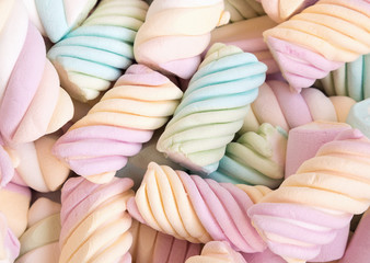 A delicious multicolored marshmallows background. Shallow depth