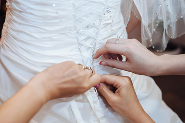 Bride getting ready. beautiful bride in white wedding dress with