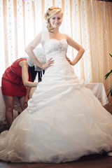 Bride getting ready. beautiful bride in white wedding dress with