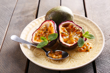 Passion fruits on wooden background