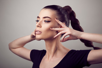 Fototapeta premium Portrait of beautiful woman with perfect skin and make-up