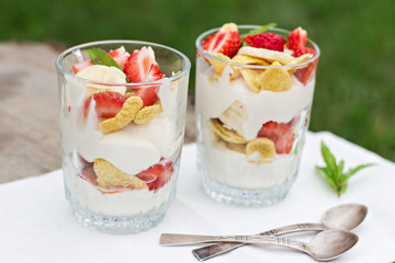breakfast - cheese, strawberry, banana, cornflakes on the table