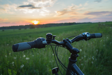 Fototapeta na wymiar bicycle on road in summer field