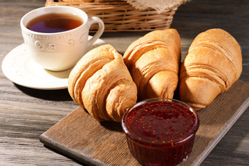 Delicious croissants on table close-up
