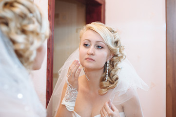 Bride getting ready. beautiful bride in white wedding dress with