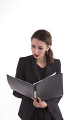 frightened business woman looking at documents in the folder