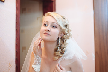 Bride getting ready. beautiful bride in white wedding dress with