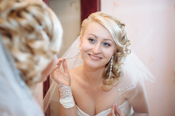 Bride getting ready. beautiful bride in white wedding dress with