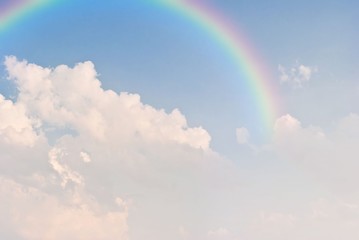 rainbow in the blue sky after the rain