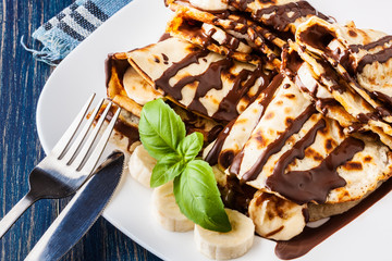 Crepes with banana and chocolate cream