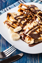 Crepes with banana and chocolate cream
