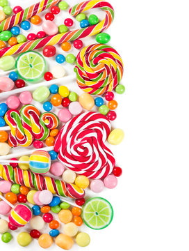 Colorful candies and lollipops isolated on a white background