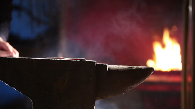 Blacksmith working on anvil