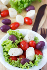 Fresh salad of heart of palm (palmito), cherry tomatos, olives