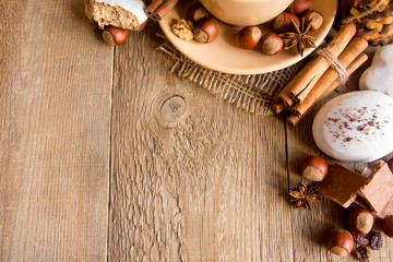 Sweets and spices on wooden background