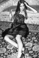 Girl lying on carpet and wearing dress black and white