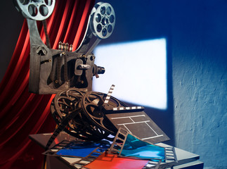 Film projector projecting a movie on the wall