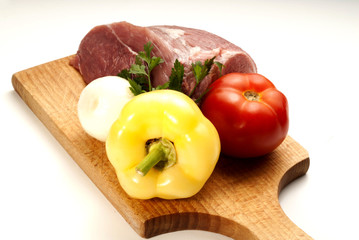 Raw fresh meat on board with condiments on white background