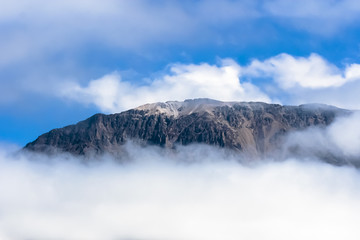 Mountains emerge from the clouds
