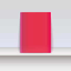 Book cover. Magazine standing on the shelf.