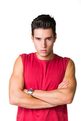 Serious young man looking at camera isolated in white background
