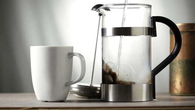 Making coffee with a French press coffee maker