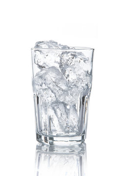  glass with ice cubes on white background