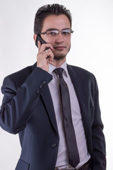 Young businessman talking on smartphone