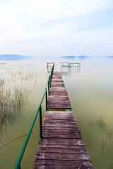 Fototapeta na wymiar Wooden pier in tranquil lake Balaton