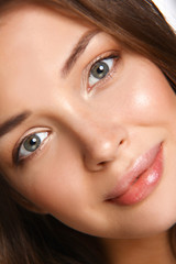 Obraz premium Close up portrait of beautiful young woman face. Isolated on