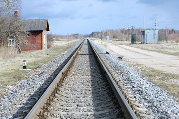 Straight section of railway track through country-side