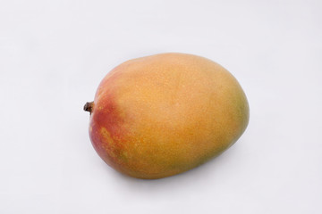 Big, ripe mango on white background.