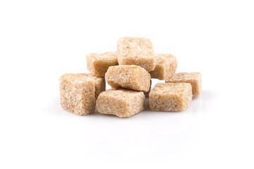 Heap brown sugar cubes isolated