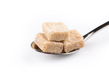 Cubes of sugar on a spoon