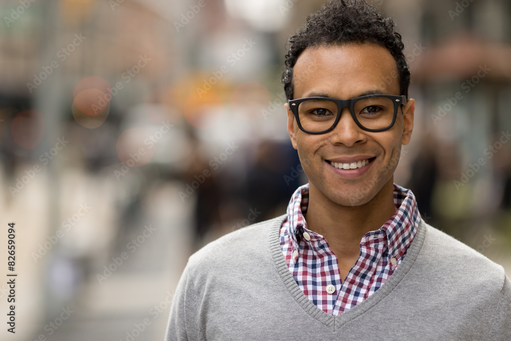 Poster Young African Asian man in New York City smile face portrait