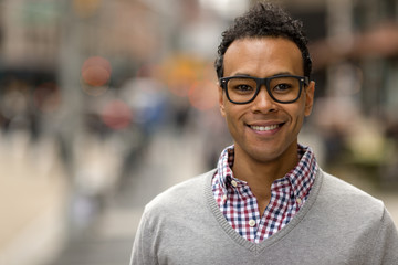 Obraz premium Young African Asian man in New York City smile face portrait