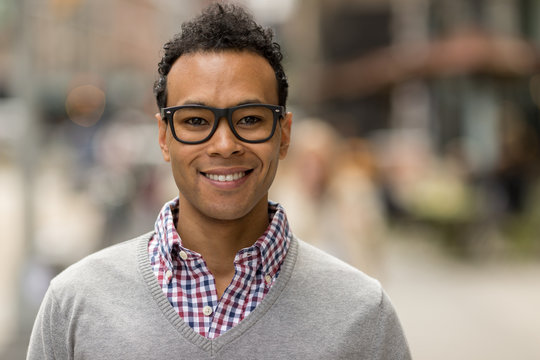 Young African Asian man in New York City smile face portrait