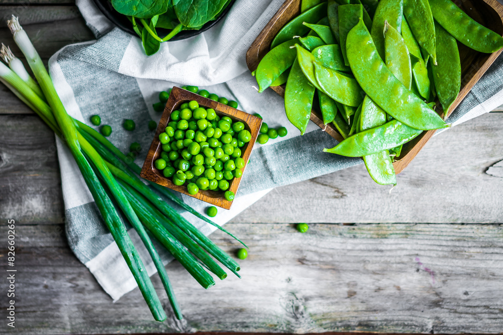 Wall mural green vegetables on wooden background