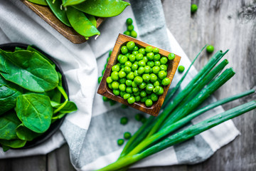 Green vegetables on wooden background