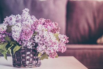 Bouquet of lilacs on wooden background