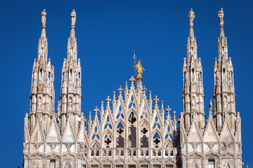 Fototapeta na wymiar Marble spires of the Milan Cathedral