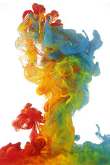 Clouds of bright colorful ink mixing in water