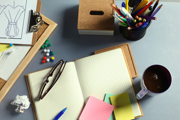 Designer's table with notes and tools