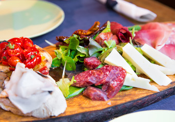 Italian appetizers on a wooden board