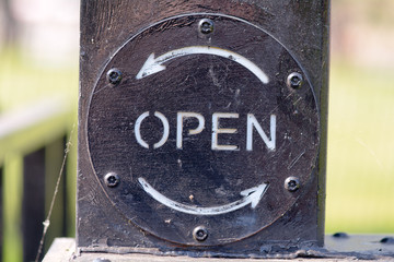 Open sign on canal lock gate
